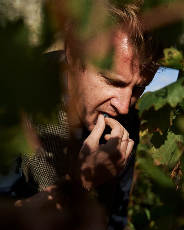 Arnaud tasting grape